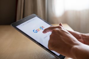 Using Google on digital tablet to check your website listing